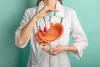 Medical professional presenting a stomach anatomy model for bariatric treatment education