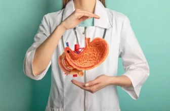 Medical professional presenting a stomach anatomy model for bariatric treatment education