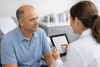 Patient discussing hair transplant recovery care with a clinician