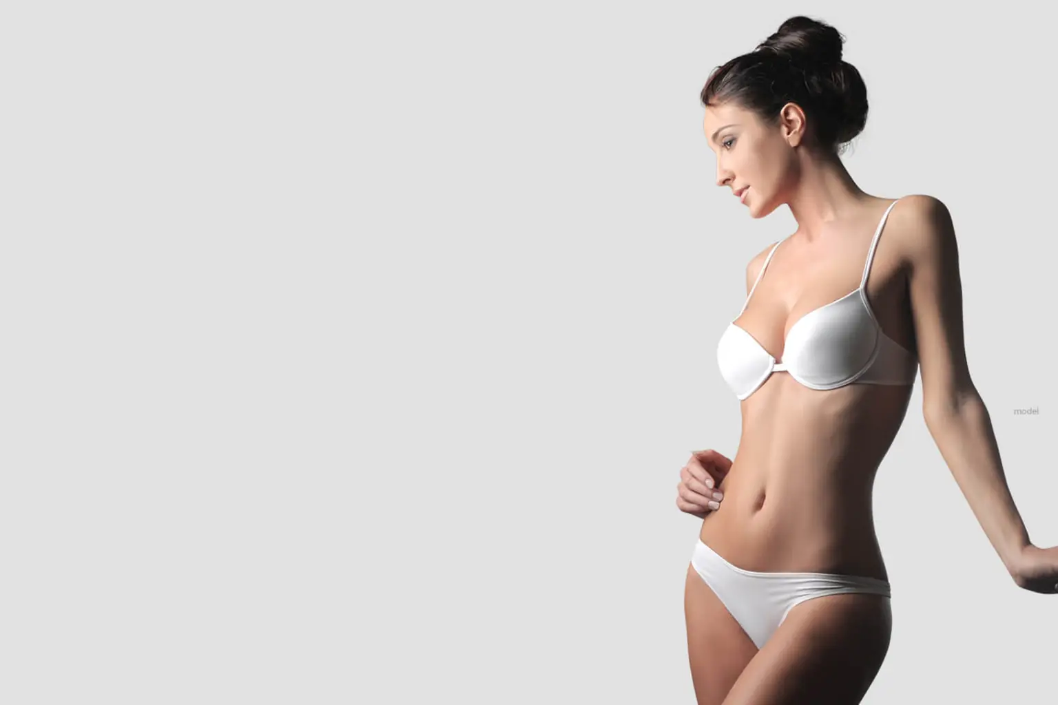 Adult woman in profile representing body contouring consultation and planning