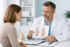 Patient discussing revision rhinoplasty with a surgeon