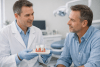 Dentist discussing veneer and crown options with a patient